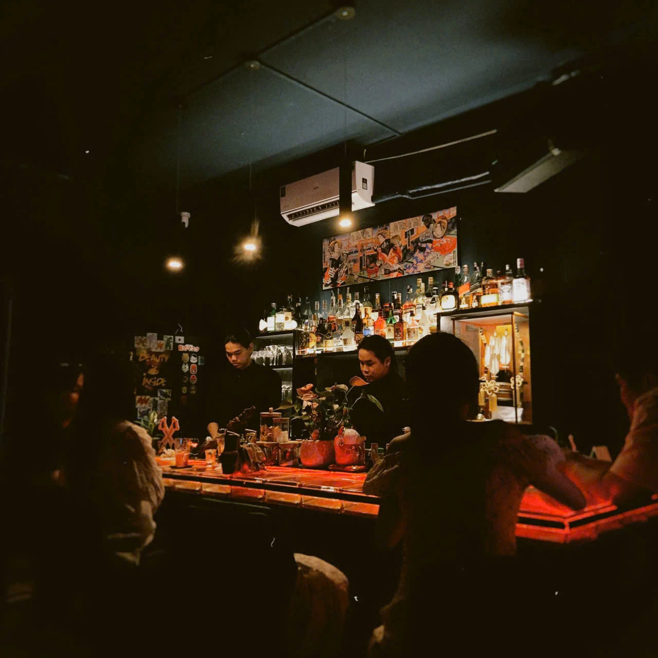 Guests sharing a quiet evening at a bar