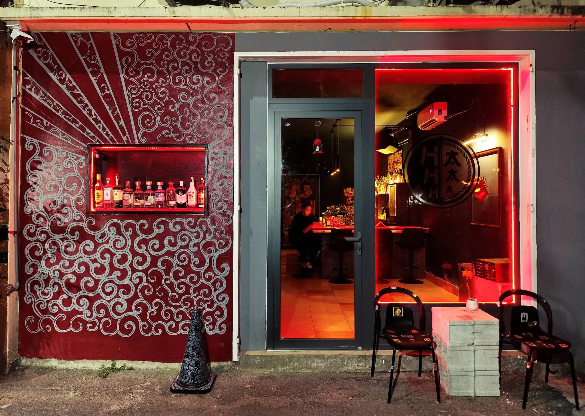 Warm, intimate hidden bar interior after dark
