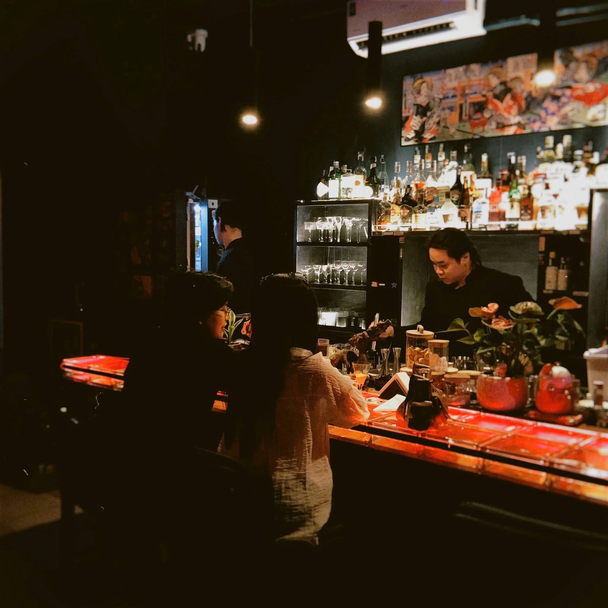 Warm hidden bar seating and interior detail